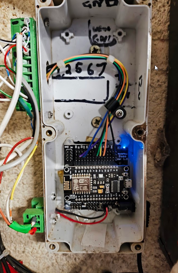 A picture of the insides. The green things on the left are connector blocks, so I can just unplug the box and take it away without all the pain of reconnecting the sensor wires afterwards_. _Being able to replace the ESP from the breakaway board is a great thing too – I have had issues where I needed to remove it to reflash after a bodged over-the-air update and this layout made that easy.