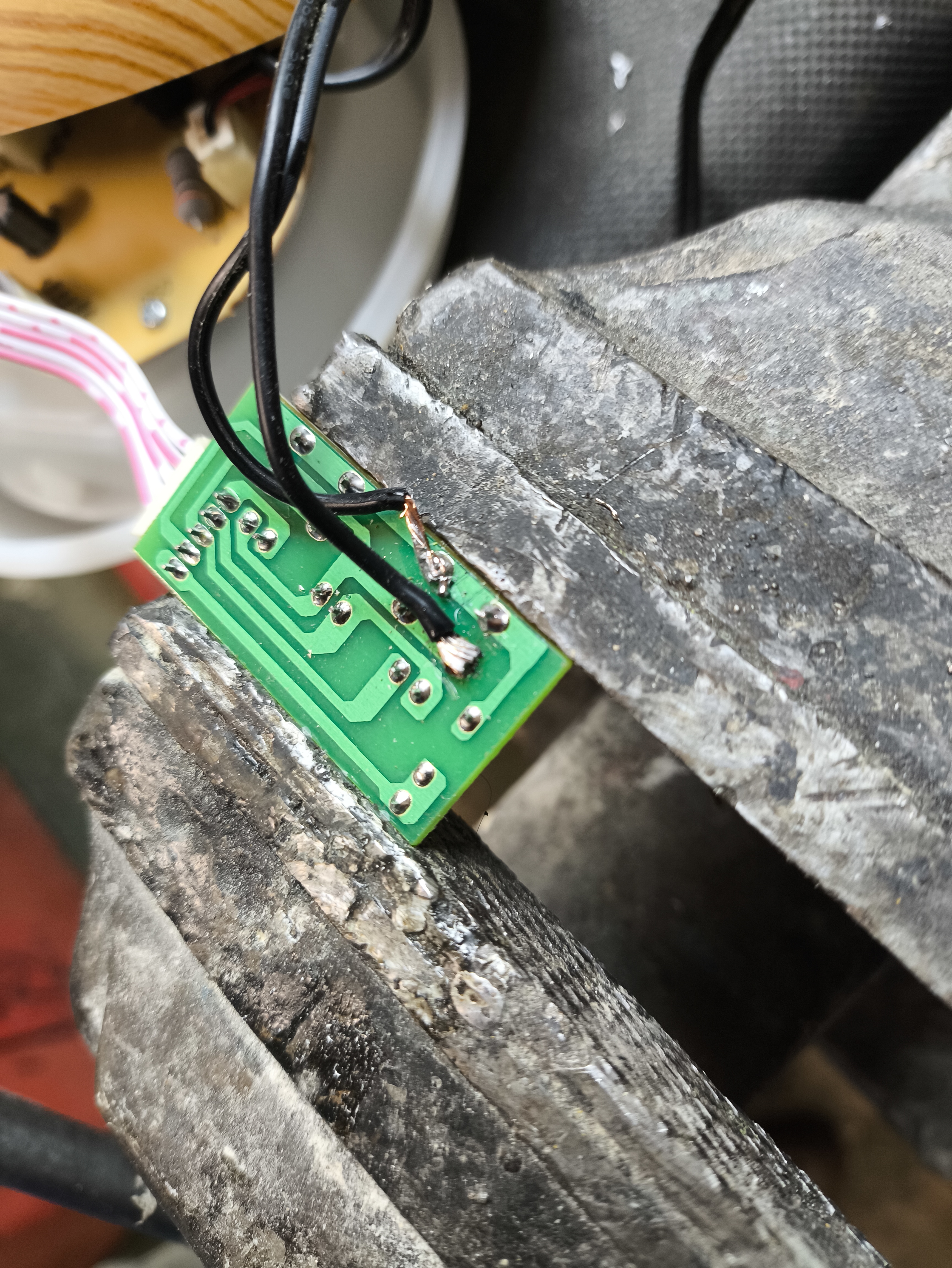 Soldering two small wires on the back of the button