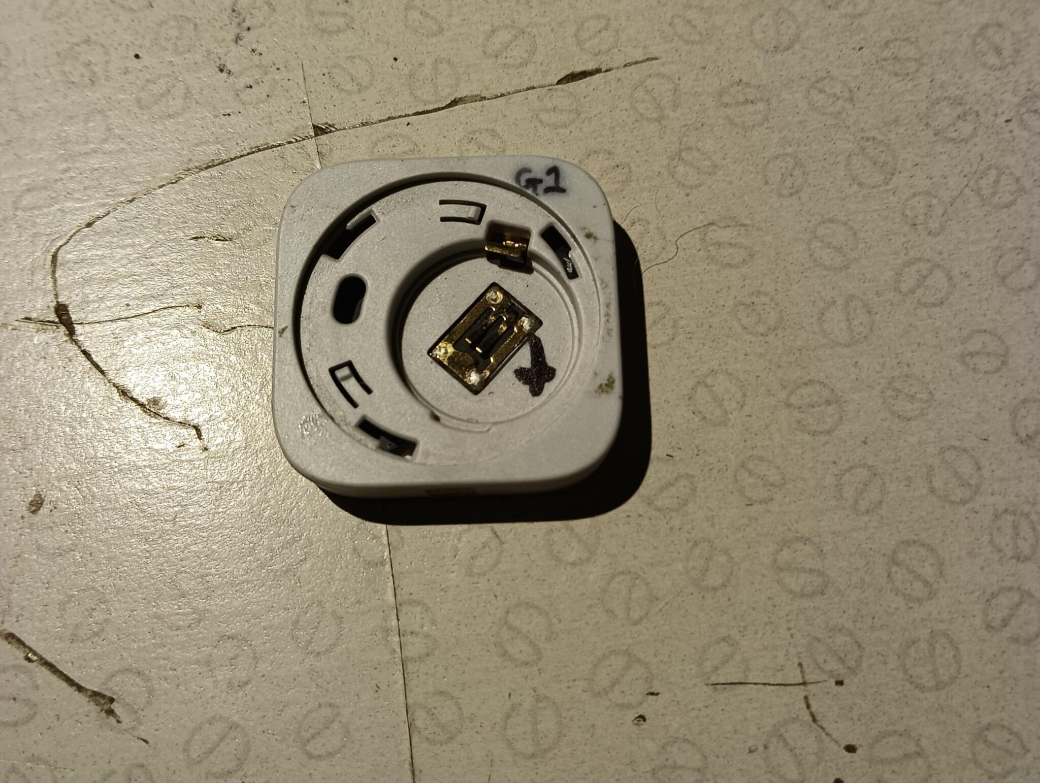 The battery compartment of an Aqara Zigbee temperature sensor