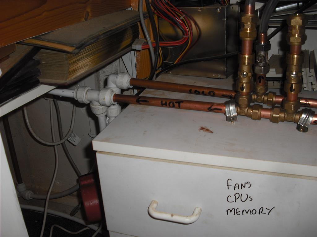 In and Out Manifolds mounted below the shelf holding the computers